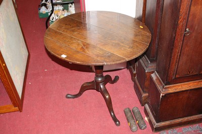 Lot 1211 - An early 19th century provincial oak circular...