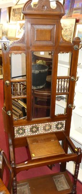 Lot 1221 - An Edwardian walnut tiled inset and mirror...