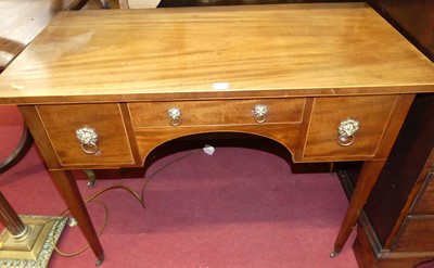 Lot 1227 - A 19th century mahogany kneehole three-drawer...