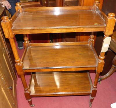 Lot 1252 - A Victorian walnut three-tier whatnot, raised...