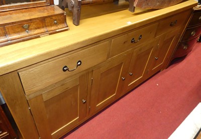 Lot 1272 - A contemporary blond oak long sideboard,...