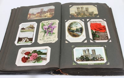 Lot 622 - An album of vintage postcards, to include...