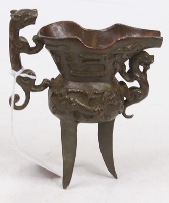 Lot 625 - A reproduction Chinese verdigris metal tripod...