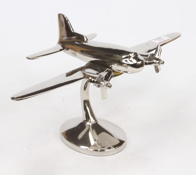 Lot 629 - A modern plated metal desk ornament in the...