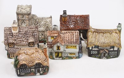 Lot 631 - A collection of Fowler pottery models of cottages