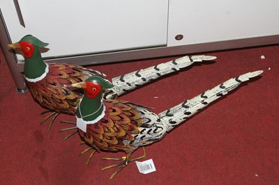 Lot 644 - Two painted metal models of pheasants, each...