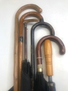 Lot 645 - A collection of vintage walking sticks and...