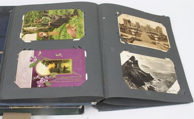 Lot 656 - Two albums of vintage postcards, to include...