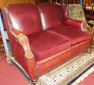 Lot 1304 - An early 20th century red leather upholstered...