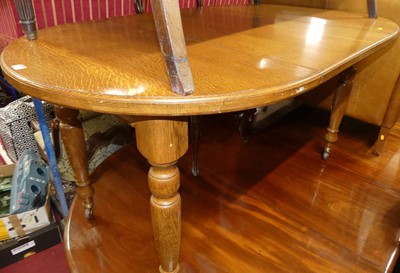 Lot 1319 - An early 20th century oak D-end extending...