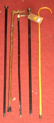 Lot 771 - A collection of vintage walking sticks, to...