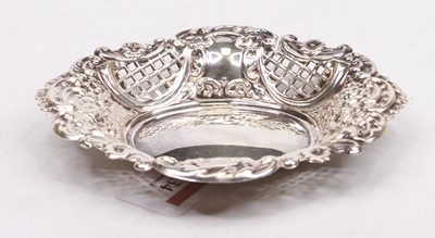 Lot 334 - An Elizabeth II repousse decorated silver...