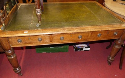 Lot 1329 - A mid-Victorian oak round cornered library...