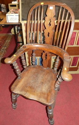 Lot 1380 - A 19th century elm and beech pierced splatback...