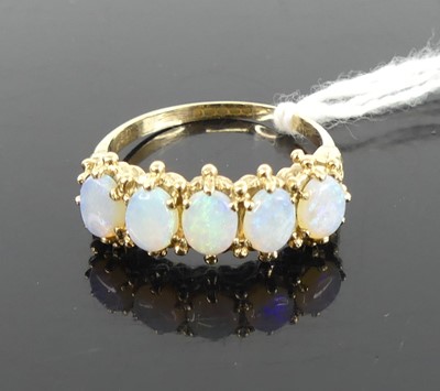 Lot 398 - A 9ct gold and opal set half hoop ring, 3.1g,...