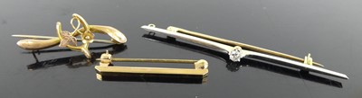 Lot 405 - A 15ct gold platinum faced and diamond set bar...