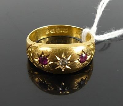 Lot 411 - An 18ct gold, ruby and diamond ring, arranged...