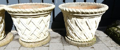 Lot 1473 - A pair of cream painted reconstituted stone...