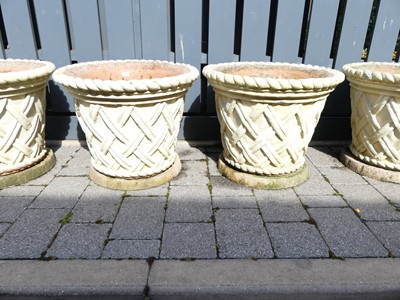 Lot 1474 - A pair of cream painted reconstituted stone...