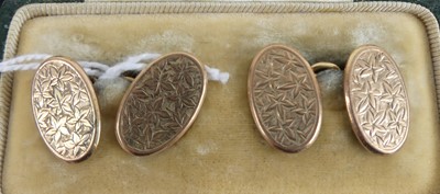 Lot 425 - A cased pair of 9ct gold engraved oval...