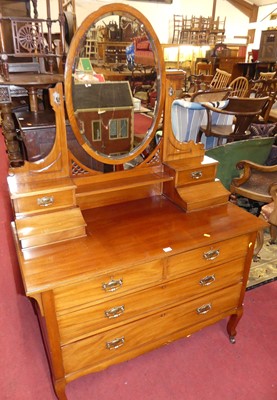 Lot 1419 - A late Victorian walnut oval bevelled swing...