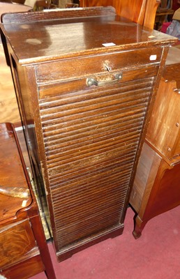 Lot 1420 - A 1920s oak tambour fronted office filing...