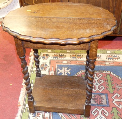 Lot 1422 - A 1930s oak piecrust topped barley twist...