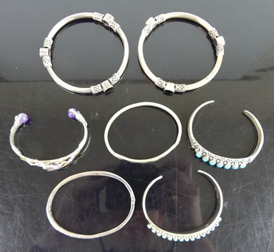 Lot 451 - Assorted silver and white metal bangles, to...