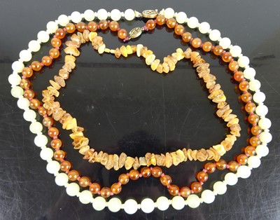 Lot 458 - A beaded and knotted carnelian necklace;...