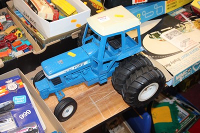 Lot 1574 - A loose playworn model of a TW20 Ford tractor...