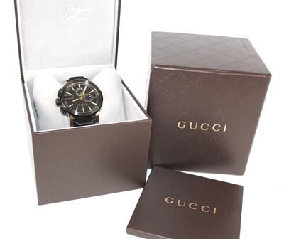 Lot 2612 - A steel and yellow Gucci G chrono quartz watch,...