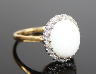 Lot 2616 - A yellow and white metal, opal and diamond...