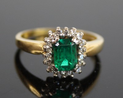 Lot 2645 - An 18ct yellow and white gold, emerald and...