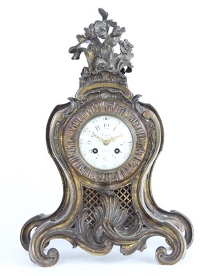 Lot 2439 - A Rococo Revival gilt bronze mantel clock, the...