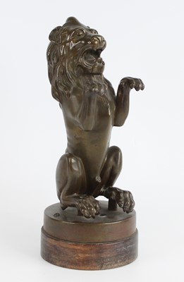 Lot 2345 - A Victorian bronze lion rampant, on circular...