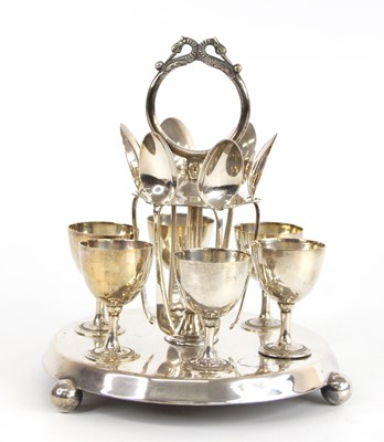 Lot 67 - A circa 1900 silver plated six-person egg cup...