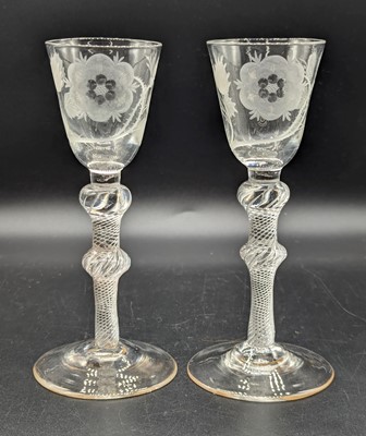 Lot 2130 - A pair of Jacobite wine glasses, the round...