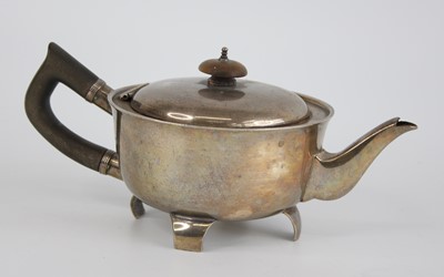 Lot 73 - An early Art Deco silver bachelors teapot, of...