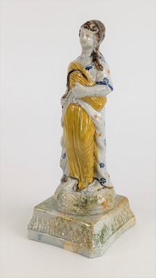 Lot 2116 - A Prattware figure of a lady, early 19th...