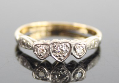 Lot 2637 - A yellow and white metal diamond three-stone...