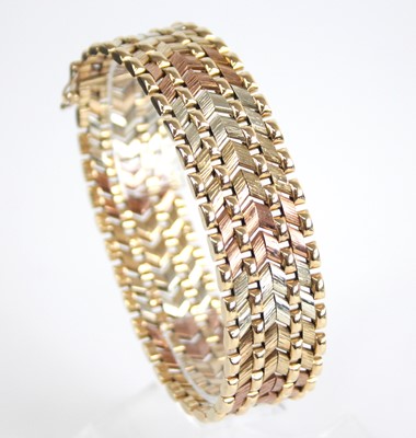 Lot 2638 - A yellow, white and rose gold chevron link...