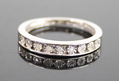 Lot 2655 - A 9ct white gold diamond half eternity ring,...