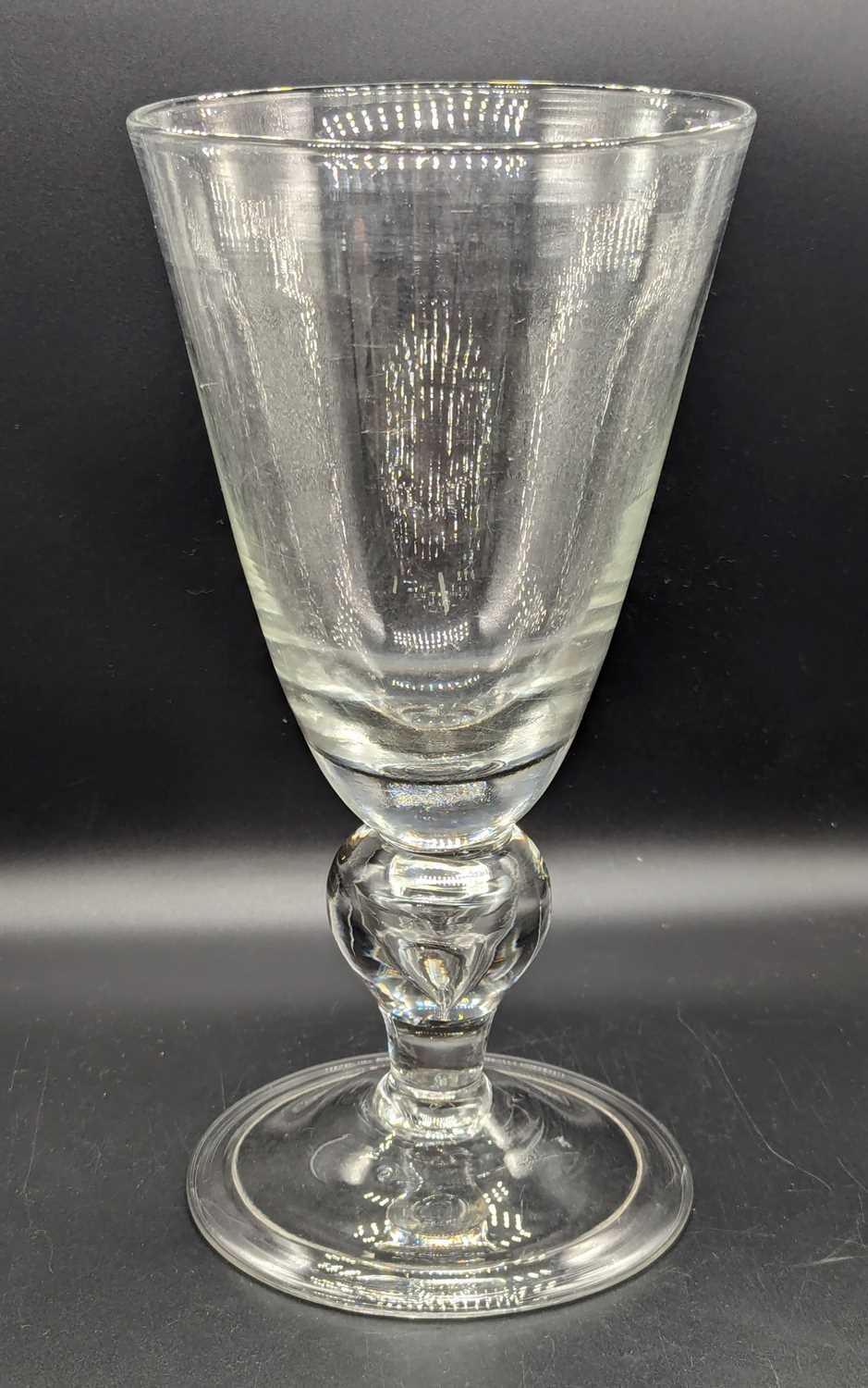 Lot 2133 - An oversized drinking glass, the round funnel...