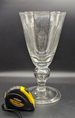 Lot 2133 - An oversized drinking glass, the round funnel...