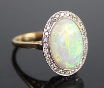 Lot 2659 - An 18ct yellow and white gold, opal doublet...