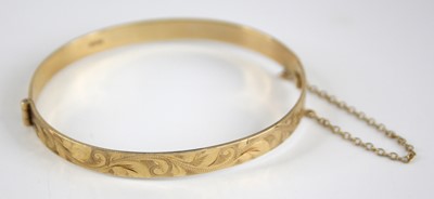 Lot 2534 - A Victorian style 9ct gold hinged bangle,...