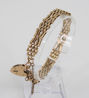 Lot 2538 - A 9ct gold gatelink bracelet, having heart...