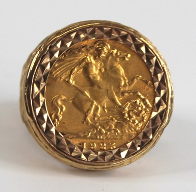 Lot 2547 - A modern 9ct gold half sovereign set ring, the...