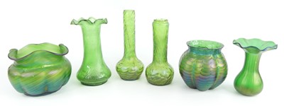 Lot 53 - A collection of six Loetz style green glass...