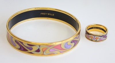 Lot 322 - A Frey Wille gilt metal and enamel bangle,...